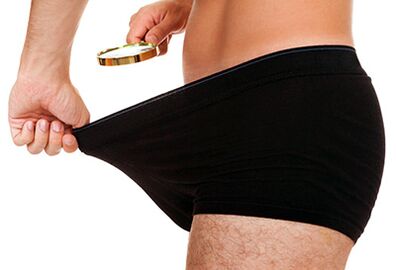 a man checks the size of his penis