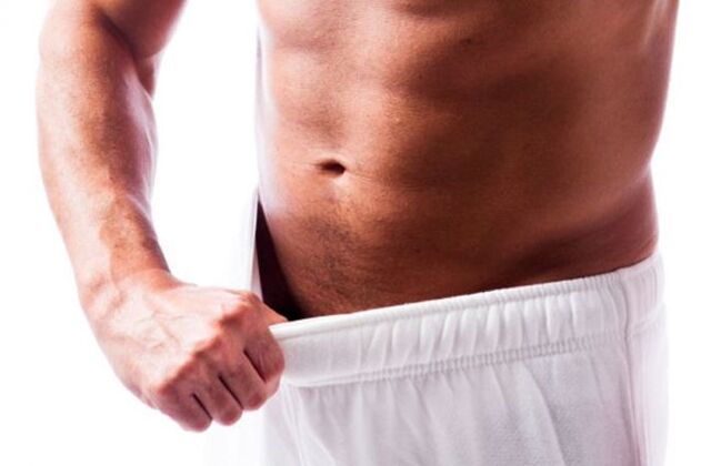 man measuring penis size